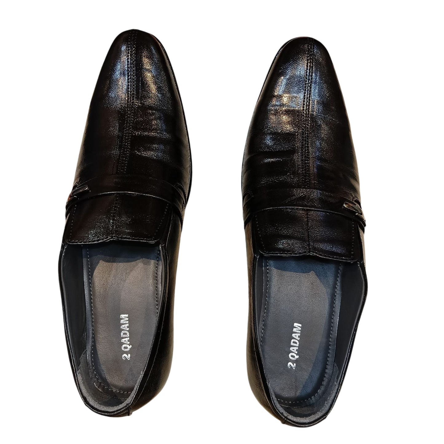 Pair of black leather shoes with '2 Dam' branding on a white background