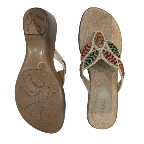 Beige sandal with decorative multicolored embellishments on a white background