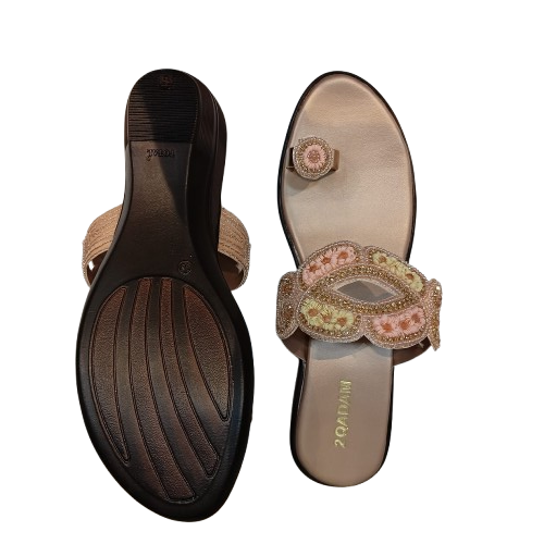 Pair of embellished sandals with a visible brand name on a white background